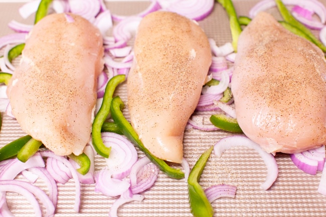 Cilantro Lime Chicken from thelittlekitchen.net chicken, red onions and bell peppers on a baking sheet