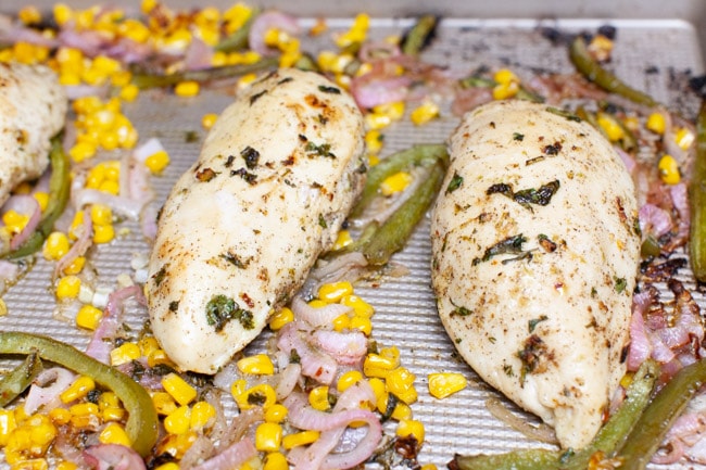 Cilantro Lime Chicken from thelittlekitchen.net chicken, red onions and bell peppers on a baking sheet