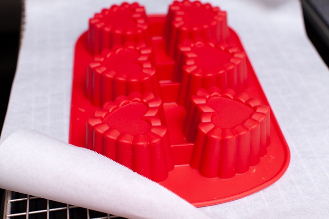 Heart Shape Chocolate Cake from thelittlekitchen.net upside down heart shaped pan on parchment paper