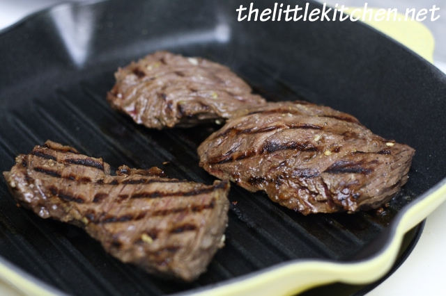 Grilling the steaks on a cast iron grill pan