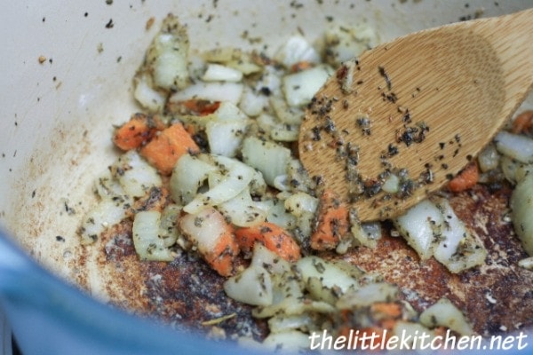 Add the flour to the vegetables after they have cooked down a little