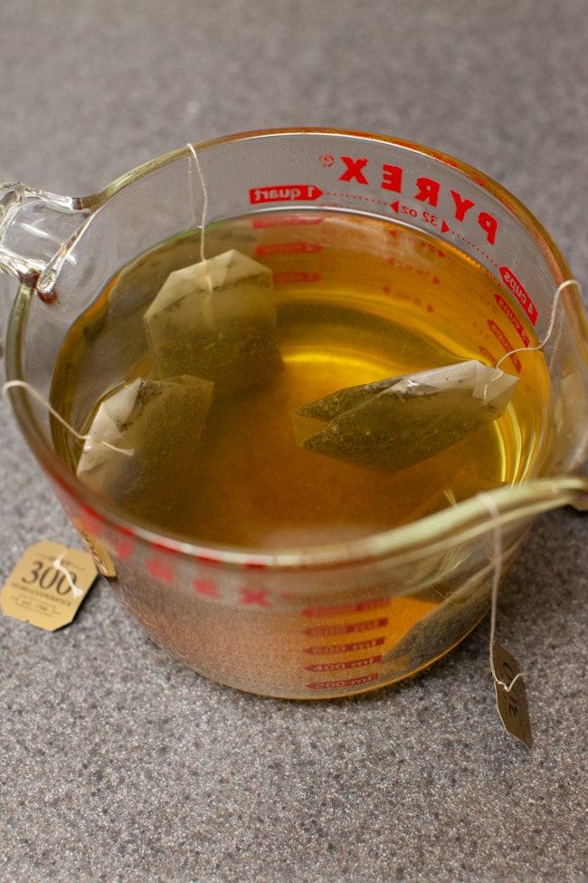 Orange Mint Tea from thelittlekitchen.net tea bags steeping in a measuring cup