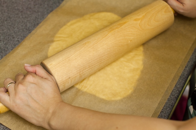 Rolling Sugar Pie crust between sheets of parchment paper Rolling Sugar Pie crust between sheets of parchment paper