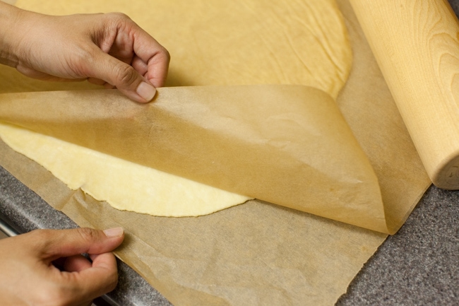 Rolling Sugar Pie crust between sheets of parchment paper Rolling Sugar Pie crust between sheets of parchment paper