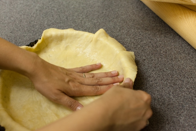 Hands pressing Sugar Pie dough into tart pan Hands pressing Sugar Pie dough into tart pan
