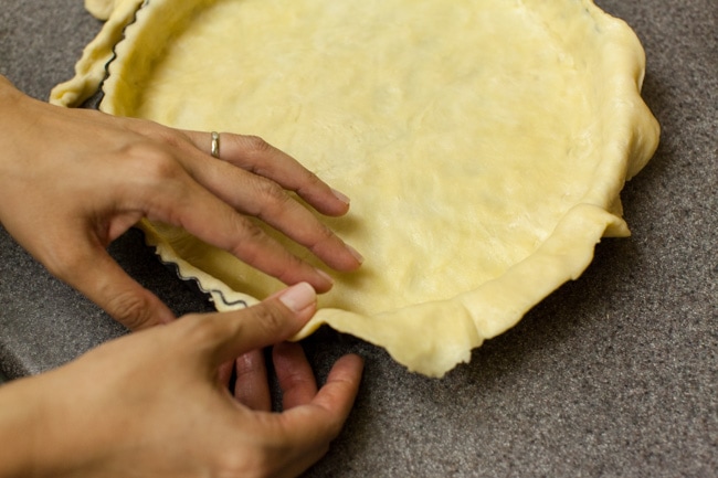 Hands pressing Sugar Pie dough into tart pan Hands pressing Sugar Pie dough into tart pan